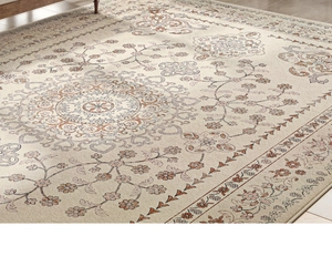 Detailed texture of beige French retro carpet with vintage floral medallion patterns