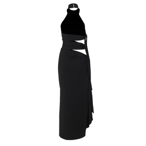 Detailed view of side cut-out sections and ruched fabric on a black halter maxi dress