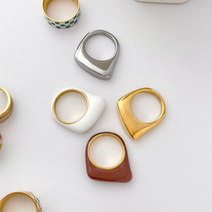 Irregular geometric enamel rings with checkered patterns and gold metal inner bands