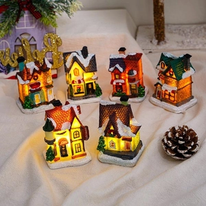 Set of 6 glowing resin Christmas village houses with LED lights and snow-covered roofs