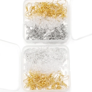 Boxes containing gold and silver earring hooks with clear silicone earring backings