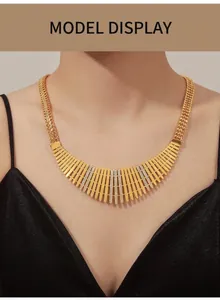 Macro detail of gold-tone fence-style wide necklace with sparkling zircon stone rows