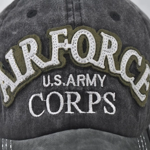 Front close-up of dark grey washed cotton baseball cap with military embroidery detail