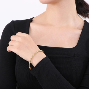 Elegant gold beaded titanium steel bracelet in minimalist bamboo style for women