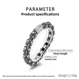 Detail of vintage skull engraved stainless steel link bracelet on a display stand