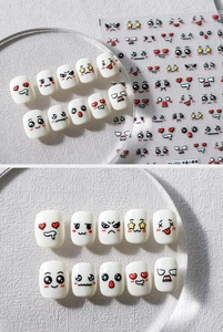 Detail view of cartoon expression nail art stickers and white 5D press-on nail set TS-2331
