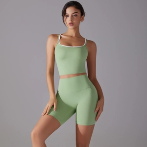 Women's mint green yoga set with slim fit sports bra and high waisted fitness shorts