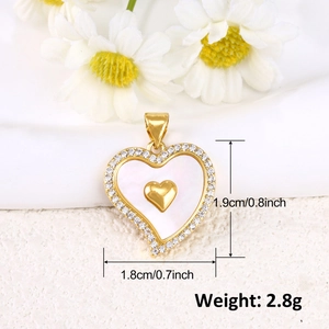 Gold-plated heart pendant with shell inlay and micro-pave detailing showing 1.9cm dimensions