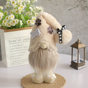 Standing faceless gnome plush with bone hat and paw prints on a warm decorative setup