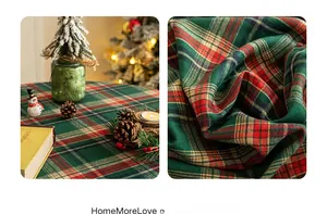 Macro detail of Christmas red and green plaid tablecloth with classic vintage fringe