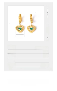 Detailed view of gold titanium heart earrings with green zircon and size dimensions