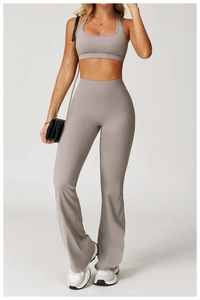 Detail of high-waist flared yoga pants and racerback sports bra in muted purple mauve