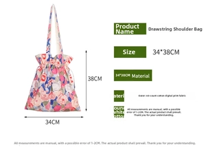 Detail view of floral drawstring canvas bag showing 34x38cm size and cotton texture