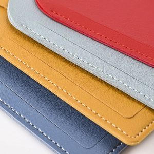 Close-up of premium PU leather passport covers with fine white stitching in four colors