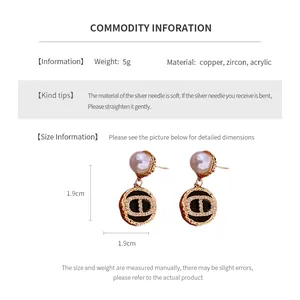 Detailed size chart for vintage pearl earrings with zircon and CD logo pendant