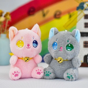 Detailed view of cute pink and grey plush kitten toys with golden bells and embroidered eyes
