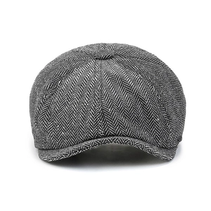 Classic black and white herringbone newsboy cap for men with a retro British design