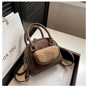 Brown faux suede and beige faux shearling detail on a rectangular tote handbag