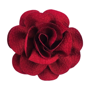 Detail view of 7cm red bubble crepe handmade fabric flower with textured petals