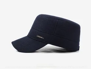 Detailed side view of navy blue warm flat cap with gold fashion metal emblem decoration