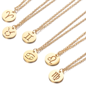 Golden 12 zodiac 304L stainless steel hollow pendant necklaces on white background