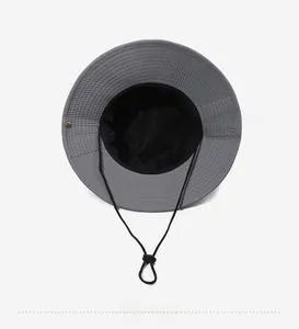 Detail view of the gray sun hat with black mesh lining and adjustable drawstring cord