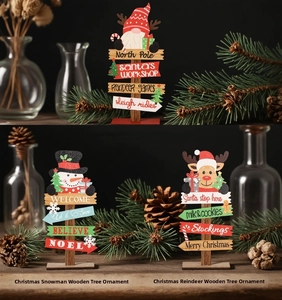 Detailed view of wooden Christmas desk ornaments featuring reindeer and snowman designs