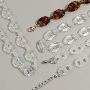 Detail of acrylic leopard print and tortoiseshell chain links with metal lobster clasps