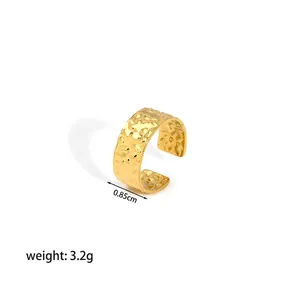 Detail view of 18K gold plated stainless steel ring with 0.85cm wide hammered texture
