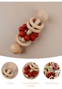 Detail showing smooth beech wood rings and red food grade silicone beads for baby teething