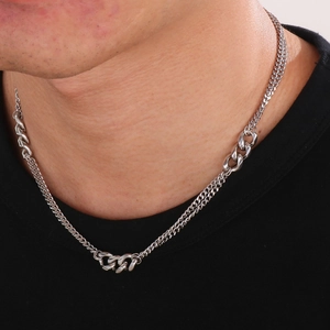 Detail of silver Cuban link necklace featuring a unique mixed double chain design for men