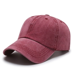 Vintage washed cotton ponytail baseball cap in burgundy red shown on white background
