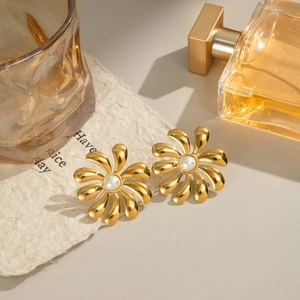 Chic 18K gold plated flower earrings with pearls on decorative paper backdrop
