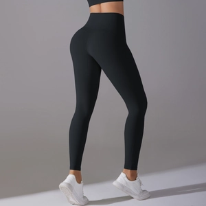 Detail view of high waisted black yoga pants with seamless fit and push-up effect
