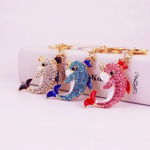 Colorful crown dolphin keychains with sparkling rhinestones in pink, blue and silver finish