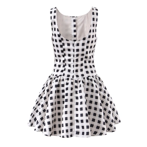 Women's backless black and white plaid mini dress with button detail and puffy A-line skirt
