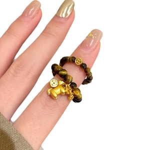 Tiger eye stone beaded ring with golden pixie and coin charm for luck and prosperity