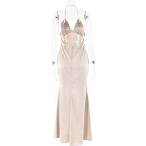 Detail view of champagne silk backless maxi dress with cross strap halter neck design