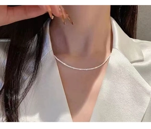 Minimalist 925 sterling silver sparkling choker necklace on model neckline