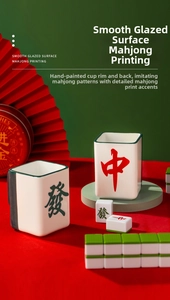 Detailed view of square ceramic mahjong mugs featuring red Zhong and green Fa characters
