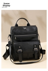 Detail of a vintage black soft leather backpack with stylish tassels and multi-pocket design