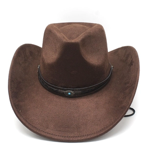 Detail of a brown suede cowboy hat with a braided leather band and turquoise stone buckle