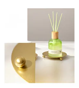 Close-up of a Nordic style golden round tray base with three spherical feet for candles