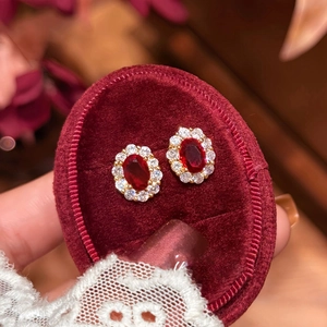 18K gold plated oval red zircon stud earrings with crystal halo on velvet stand