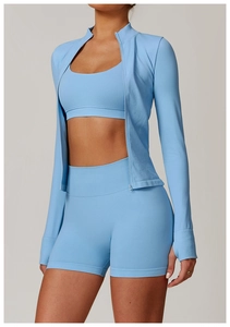 Close-up of seamless light blue yoga set featuring ribbed cuffs and zipper detail