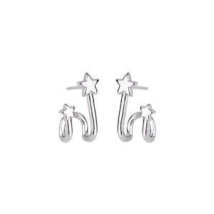 Detailed macro view of silver double star stud earrings with polished metallic finish