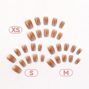 Gradient press-on nails in orange and purple, showing XS S M sizes on white background