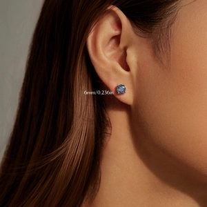 Elegant S925 sterling silver 6mm tanzanite-colored round stud earring on model
