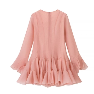 Pink long sleeve ruffle hem dress with textured fabric and elegant flared sleeves
