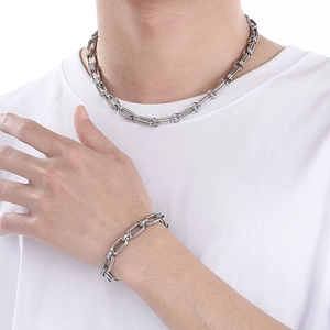 Minimalist silver stainless steel double link oval chain necklace and bracelet set on model